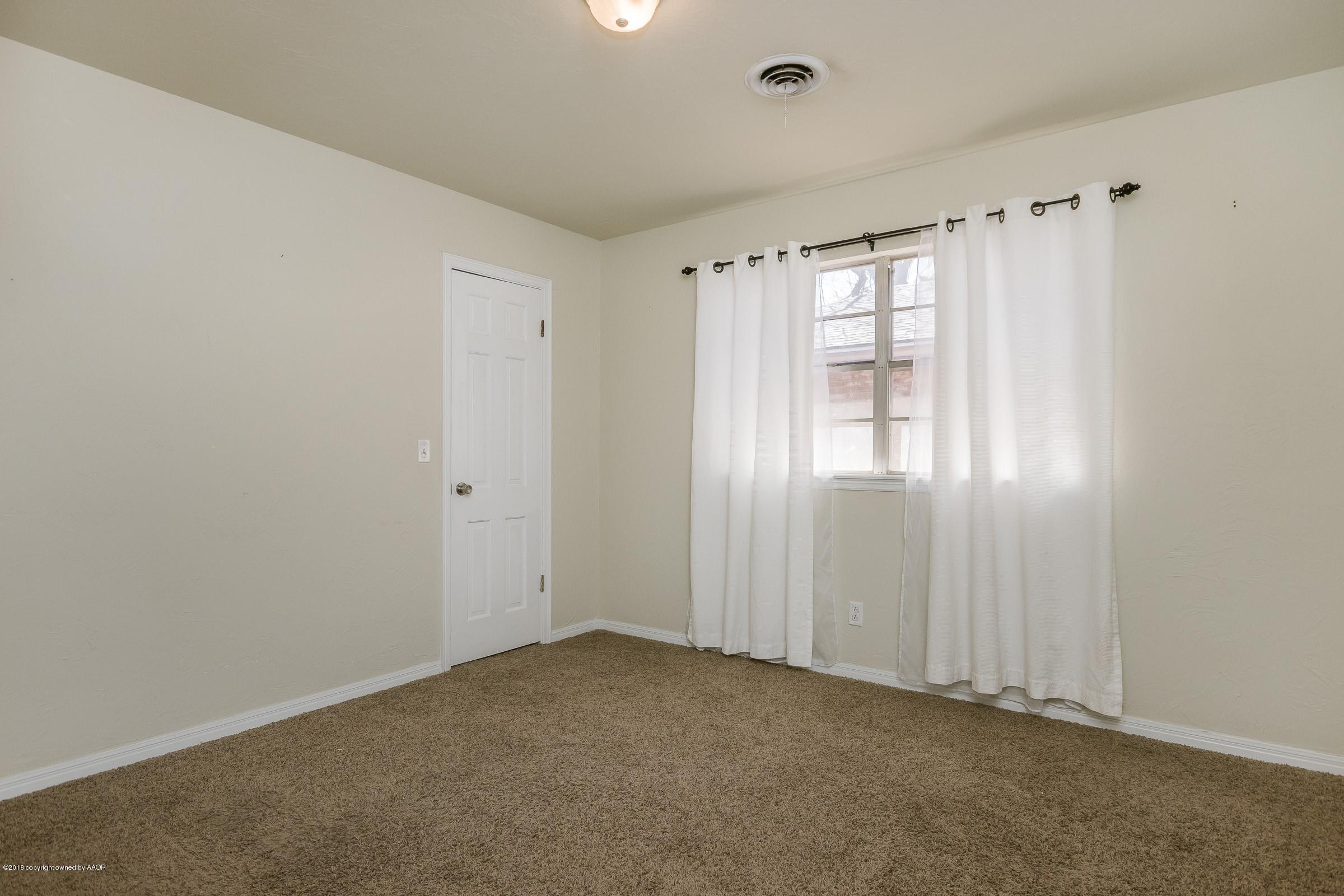 3312 Lombard Road Amarillo, TX 79106 - Photo 17 of 23 a view of an empty room with a window