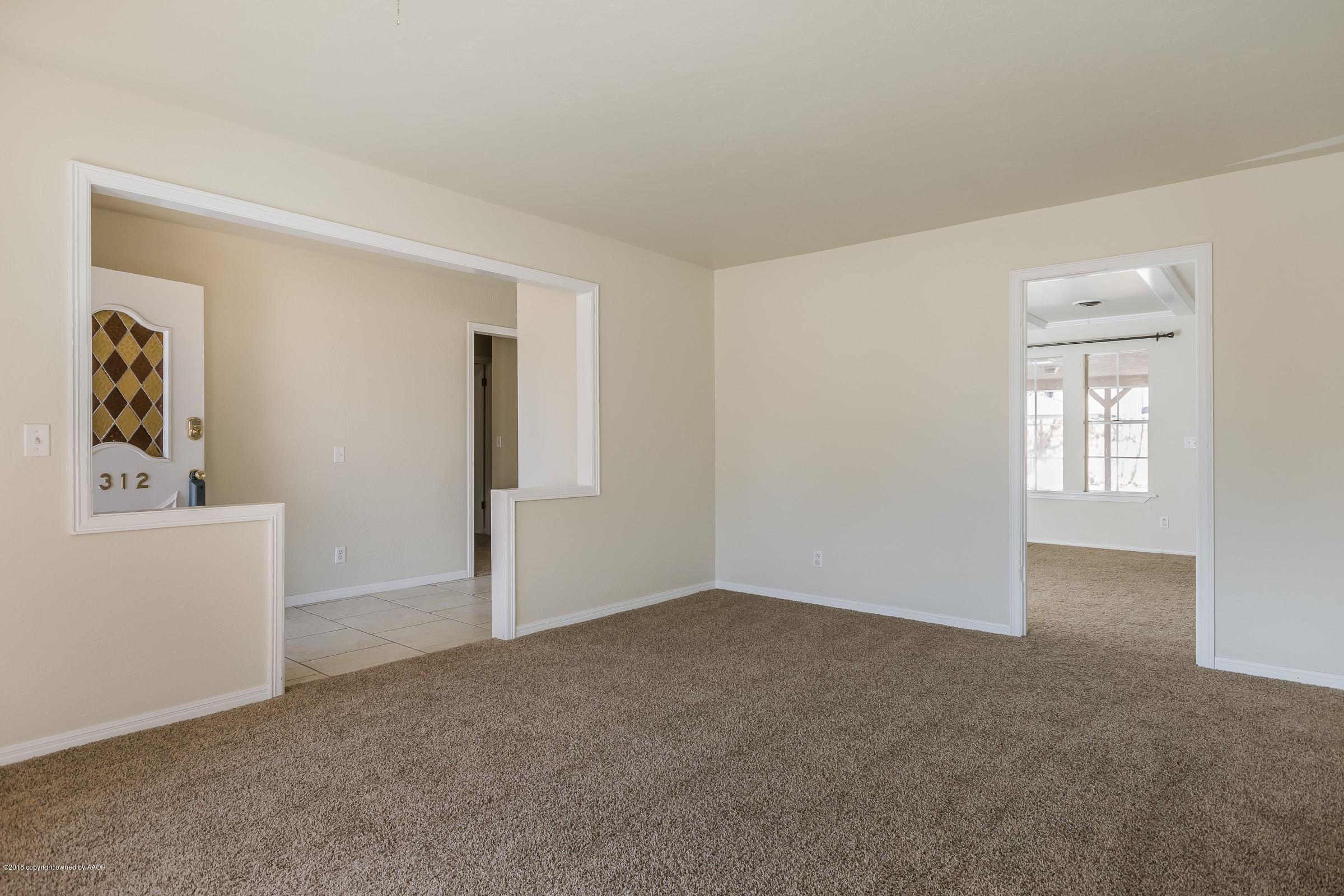 3312 Lombard Road Amarillo, TX 79106 - Photo 5 of 23 an empty room with windows