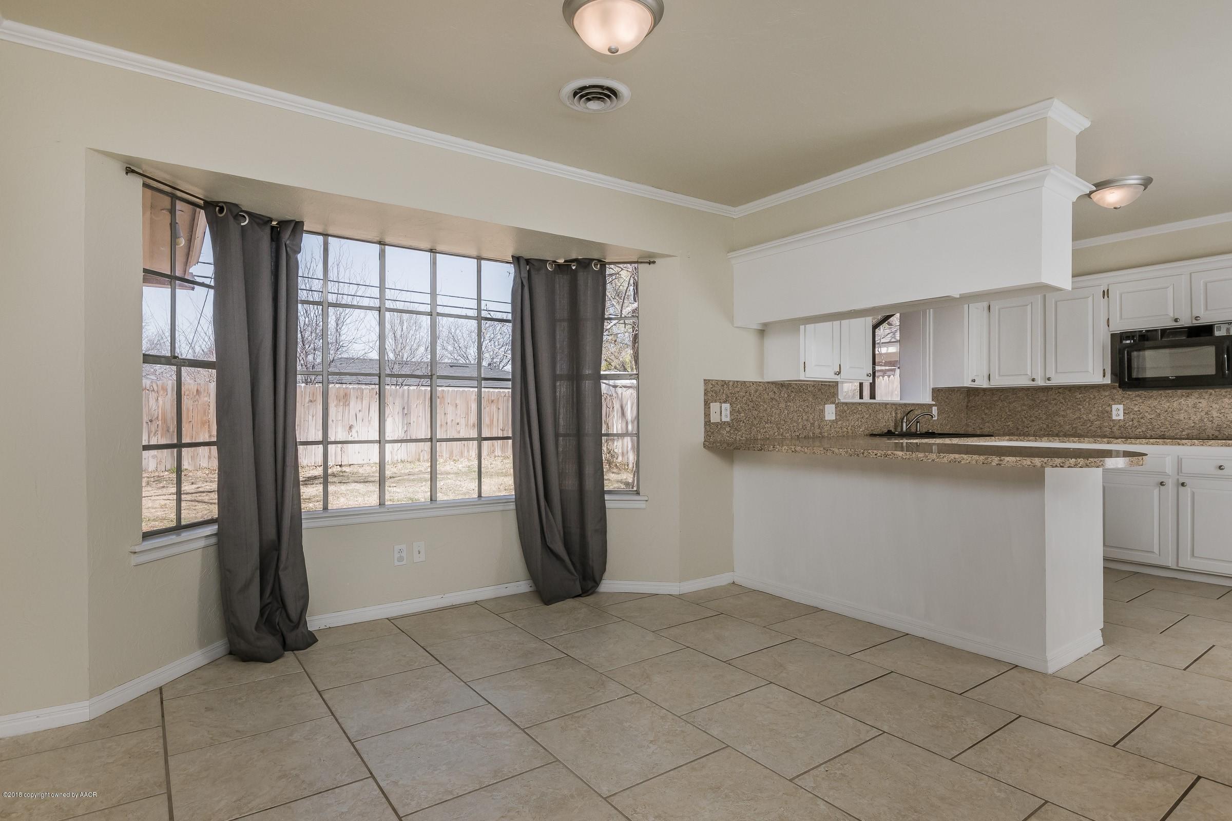3312 Lombard Road Amarillo, TX 79106 - Photo 8 of 23 a kitchen with a cabinets and appliances