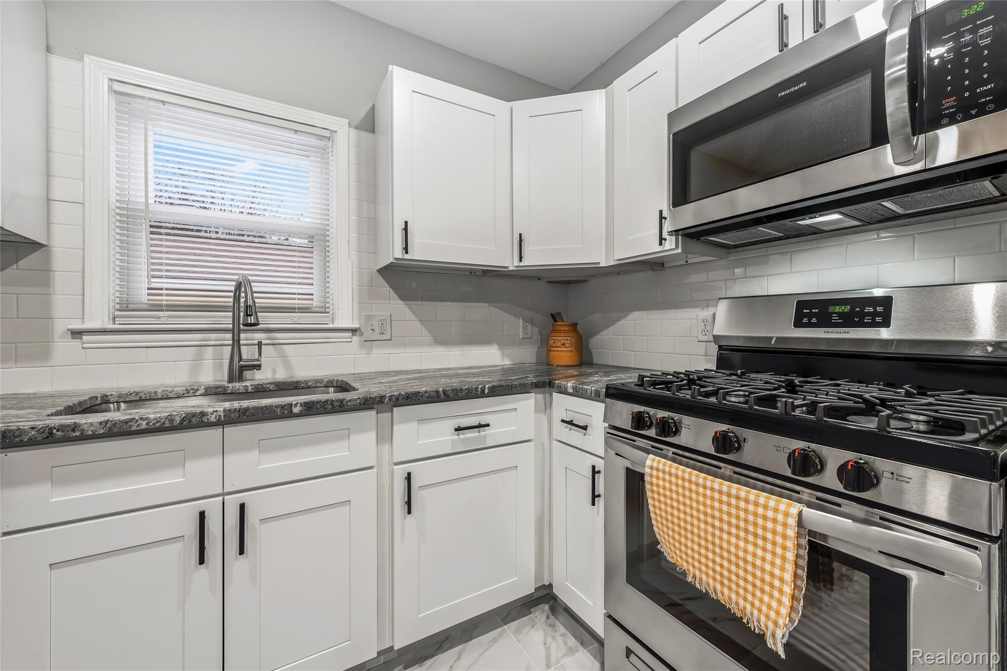8252 Stephens Road Warren, MI 48089 - Photo 13 of 24 Beautiful Granite counters with gas, Stainless Steel Appliances