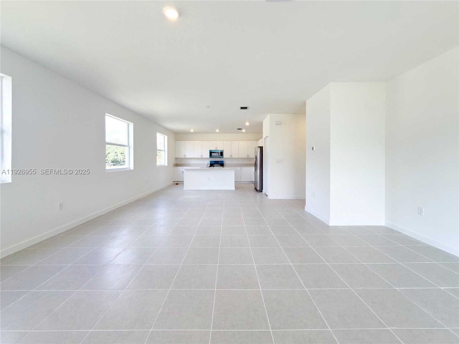 13202 Southwest 189th Terrace Miami, FL 33157 - Photo 14 of 34 a view of an empty room with a window