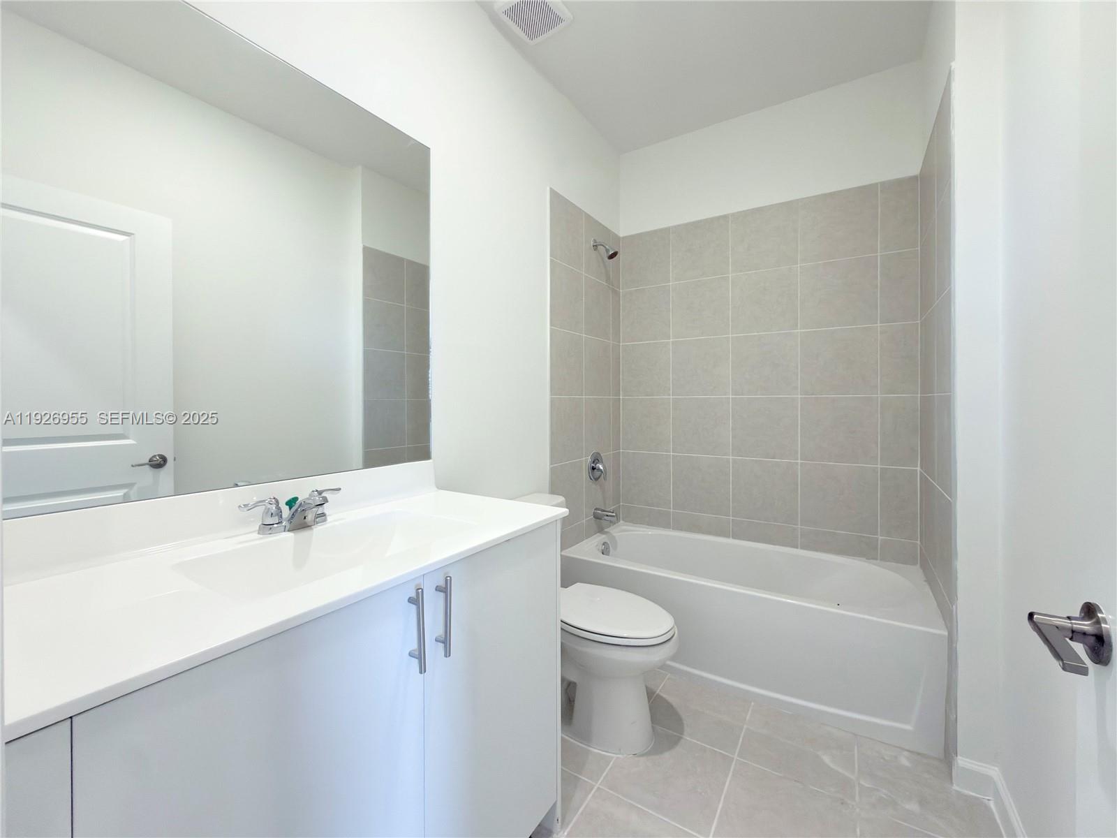 13202 Southwest 189th Terrace Miami, FL 33157 - Photo 15 of 34 a bathroom with a sink a toilet and shower