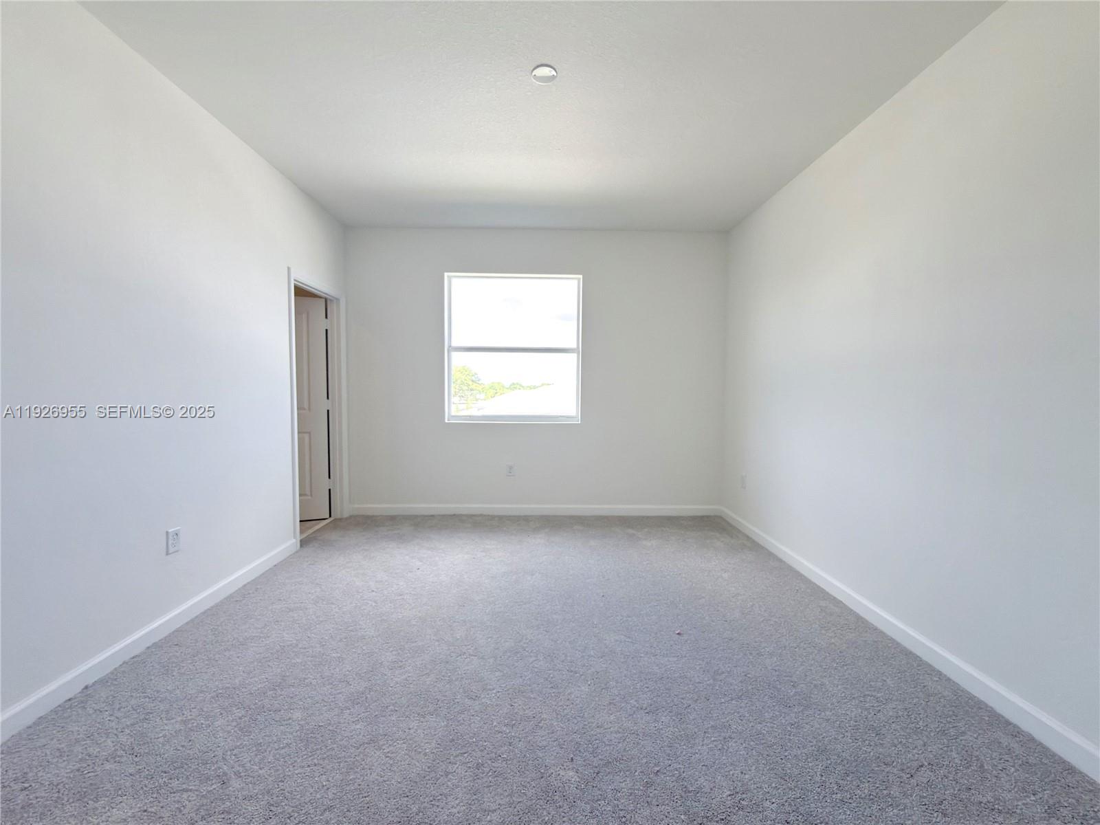 13202 Southwest 189th Terrace Miami, FL 33157 - Photo 21 of 34 an empty room with windows
