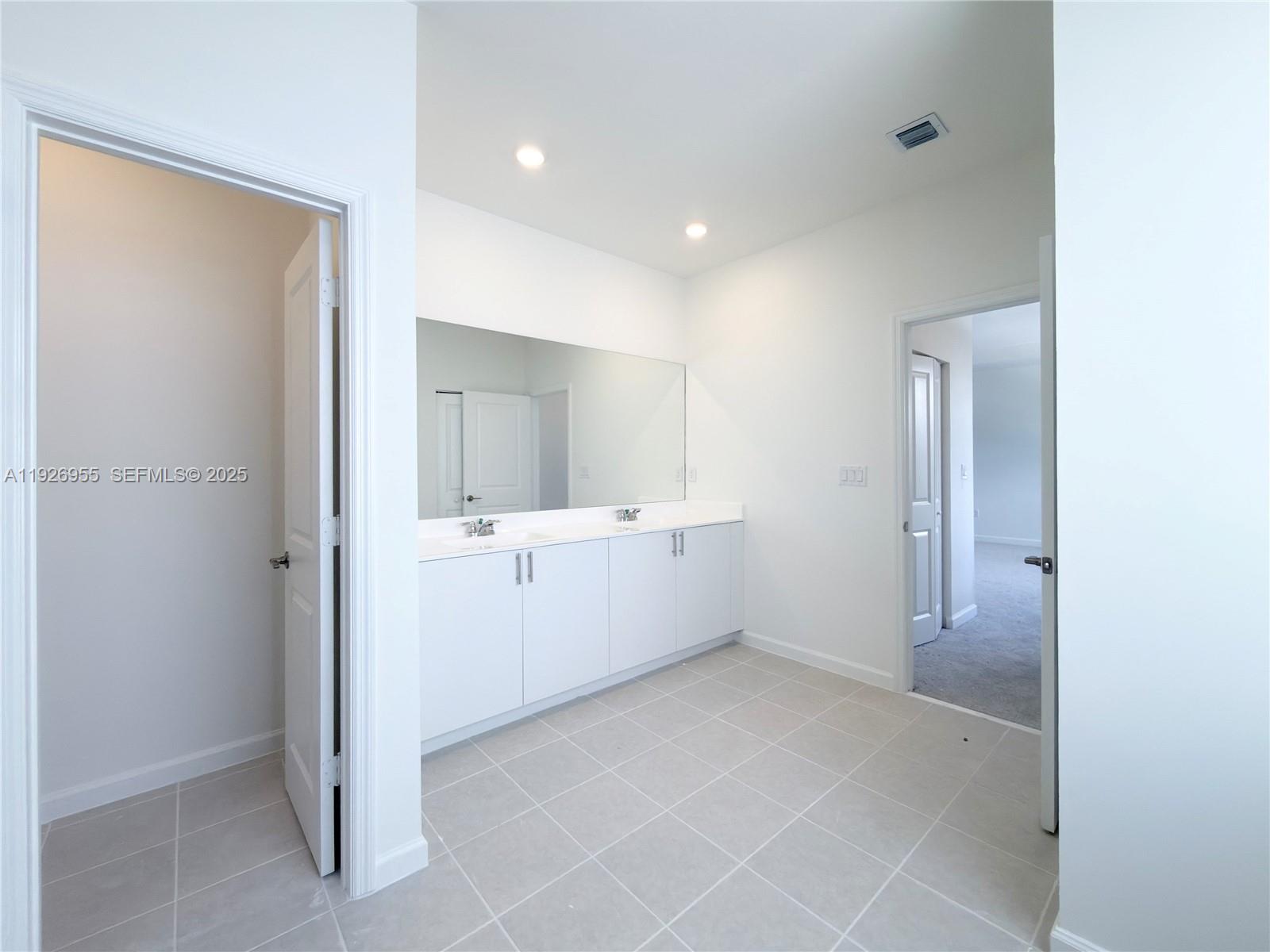 13202 Southwest 189th Terrace Miami, FL 33157 - Photo 28 of 34 a view of an empty room with window and cabinet