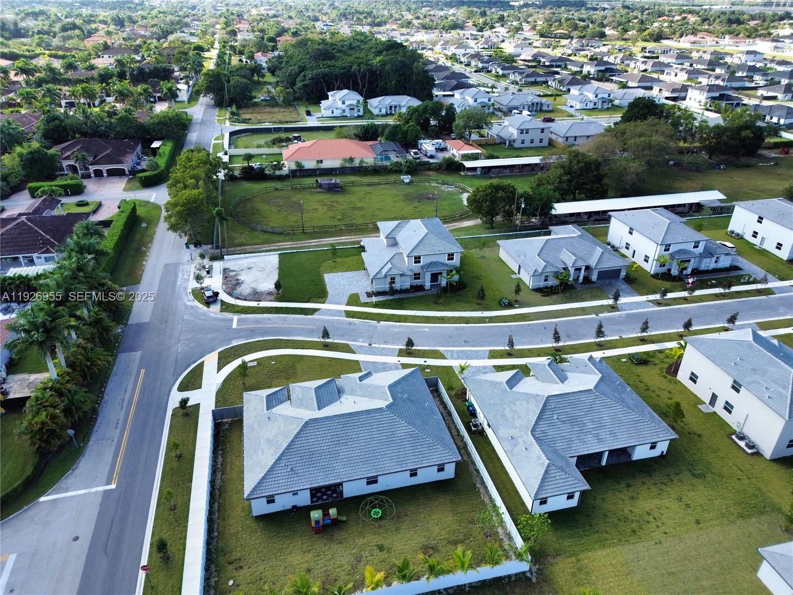 13202 Southwest 189th Terrace Miami, FL 33157 - Photo 34 of 34 an aerial view of a house with a garden and lake view