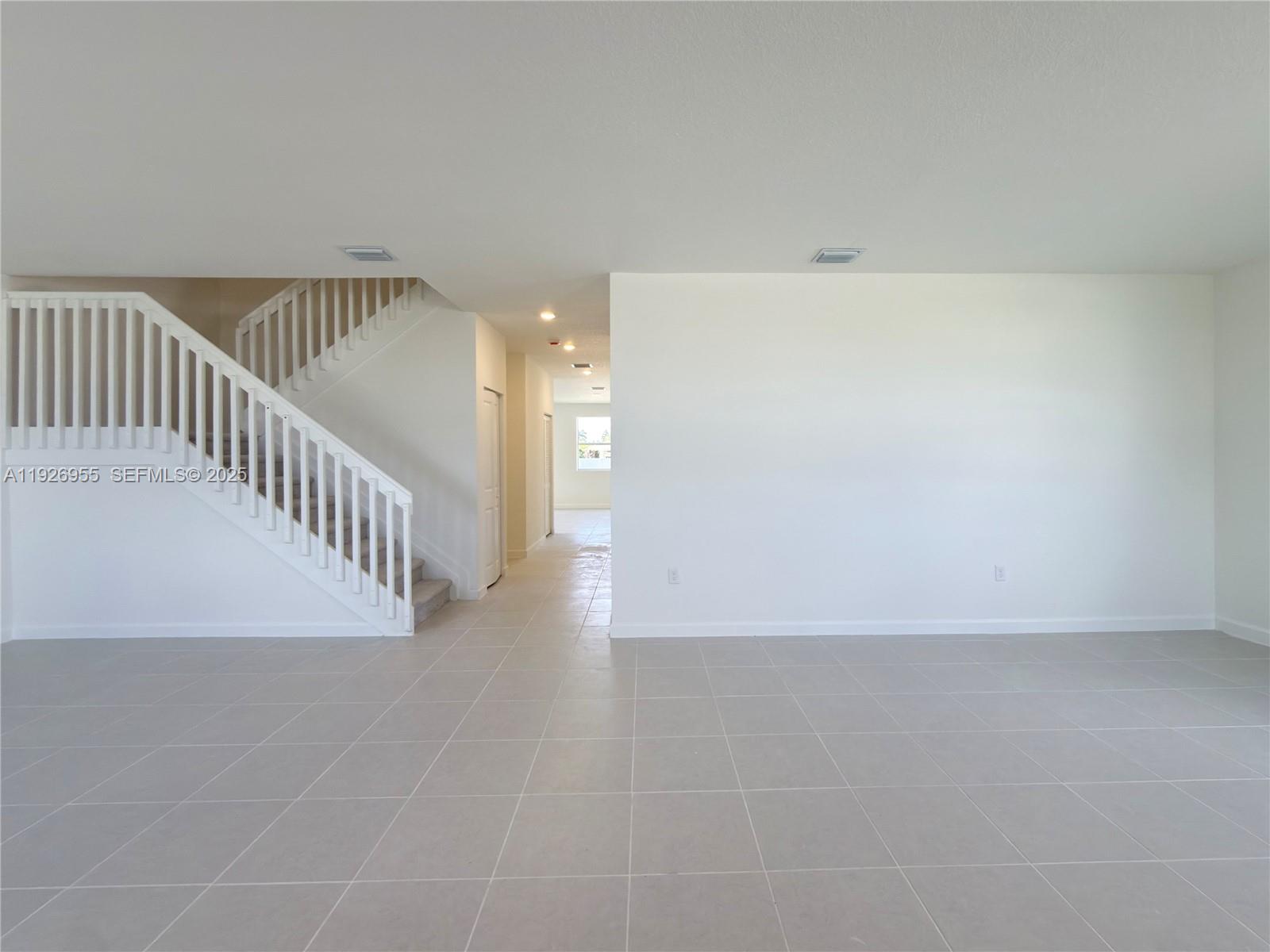 13202 Southwest 189th Terrace Miami, FL 33157 - Photo 6 of 34 a view of a hallway with staircase