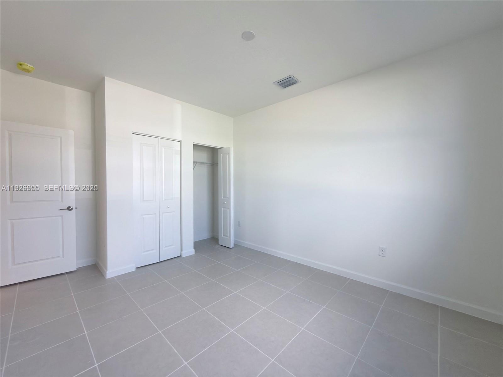 13202 Southwest 189th Terrace Miami, FL 33157 - Photo 8 of 34 a view of an empty room