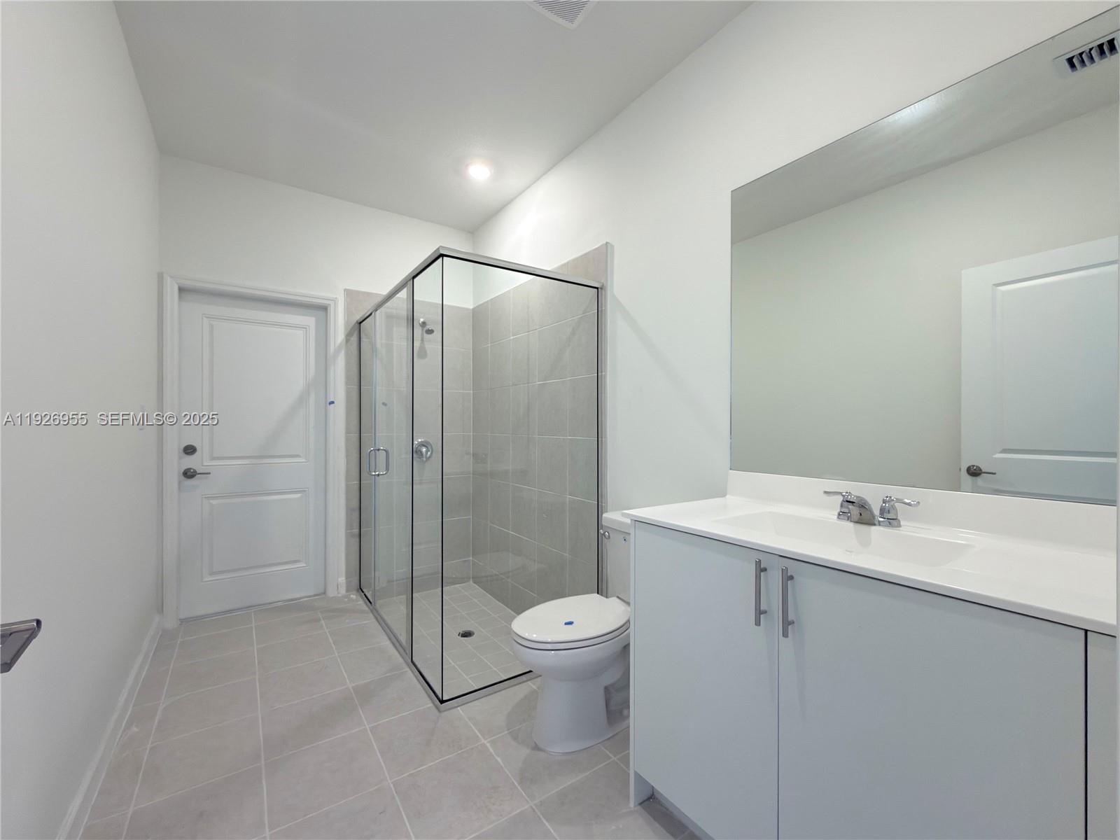 13202 Southwest 189th Terrace Miami, FL 33157 - Photo 9 of 34 a spacious bathroom with a shower sink vanity mirror and toilet