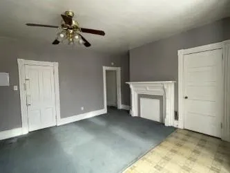 a kitchen with granite countertop a sink stove and cabinets