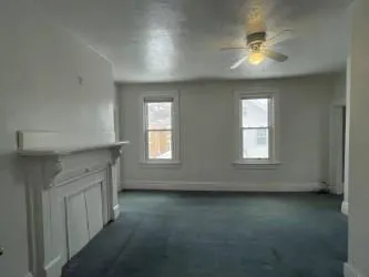 a bathroom with a toilet sink and shower