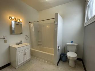 133 2nd Street, Unit 2 Pittsburgh, PA 15215 - Photo 8 of 9 a bathroom with a toilet sink and shower