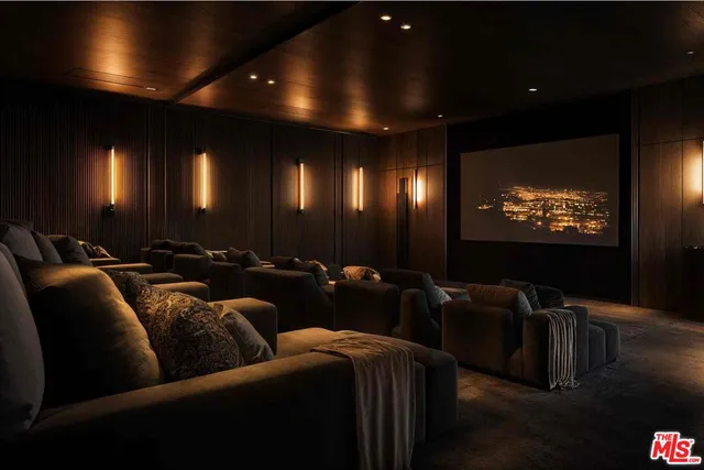 a media room with lots of chairs and a projector screen