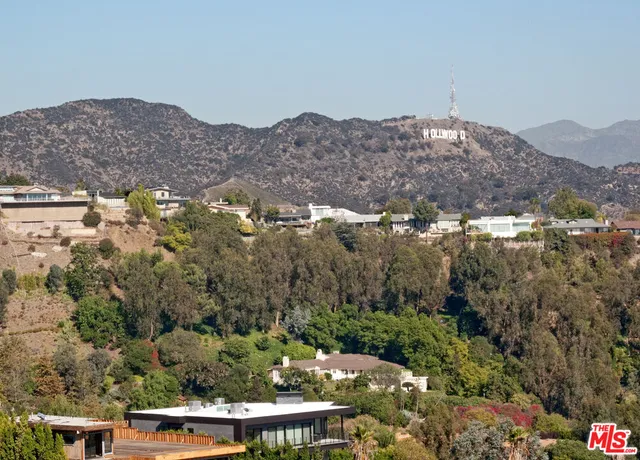 an aerial view of house with a yard