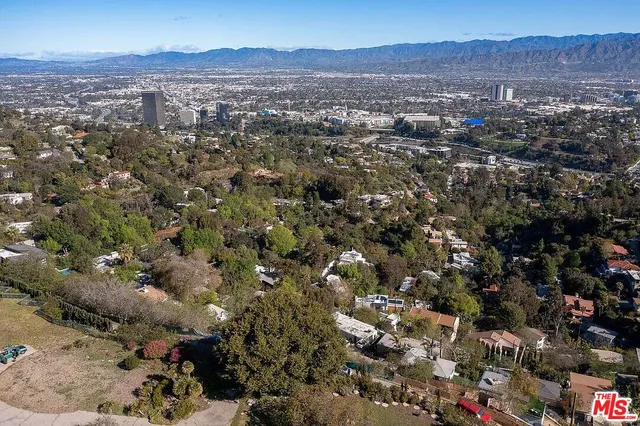 an aerial view of residential house and green space