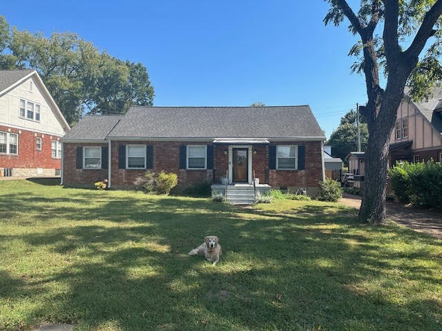 202 Mayfair Road Nashville, TN 37205 - Photo 1 of 21 a front view of a house with a garden and trees