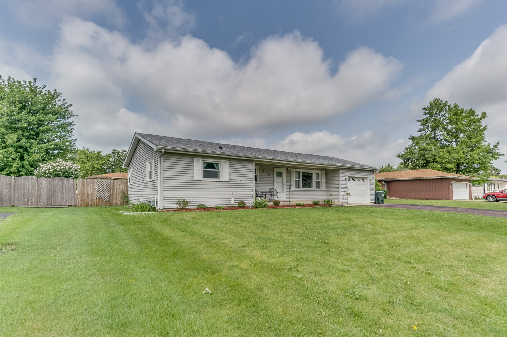 713 South Cooper Road New Lenox, IL 60451 - Photo 2 of 21 a house view with a garden space