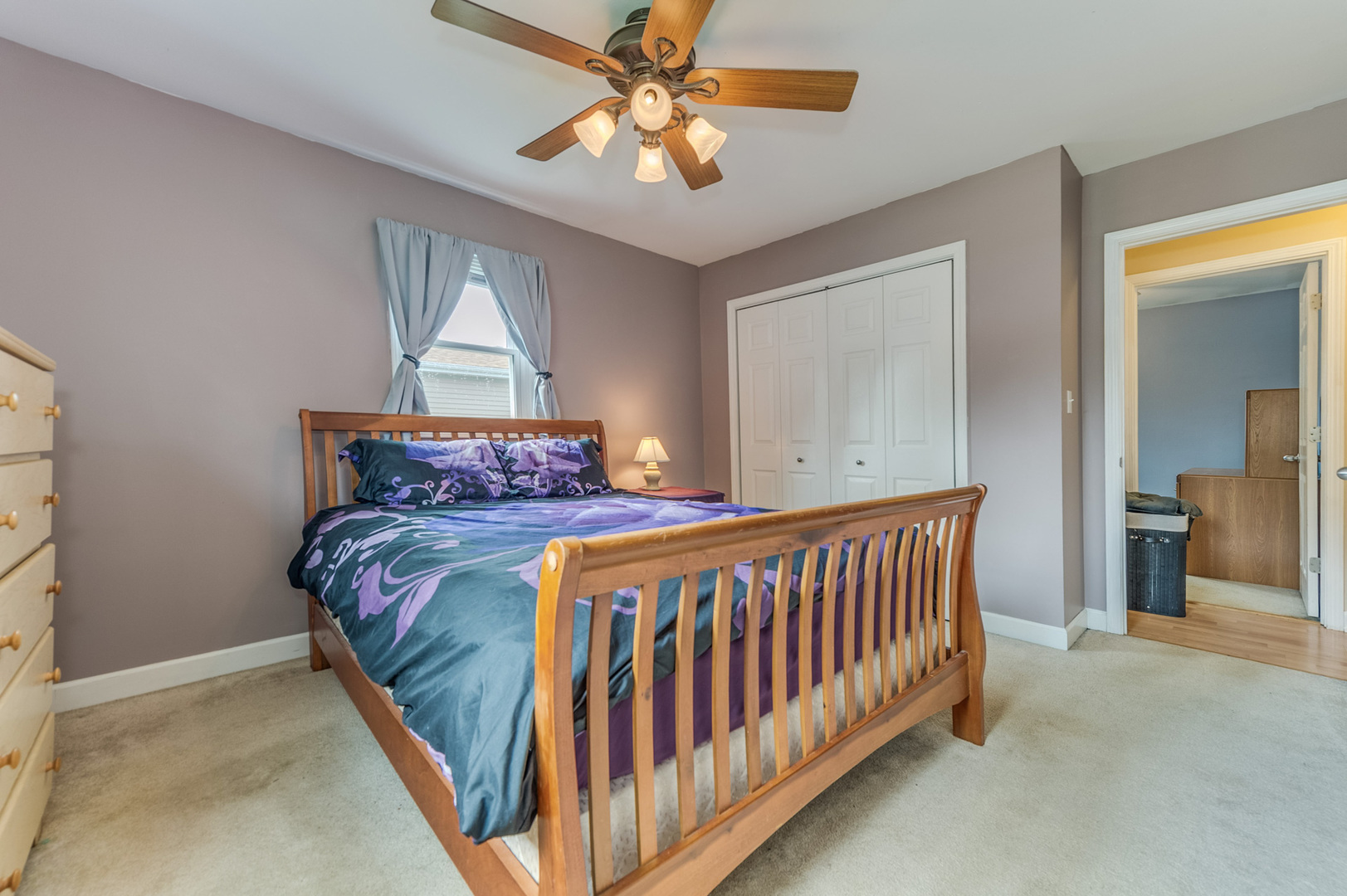 713 South Cooper Road New Lenox, IL 60451 - Photo 15 of 21 a bedroom with a bed and a chandelier