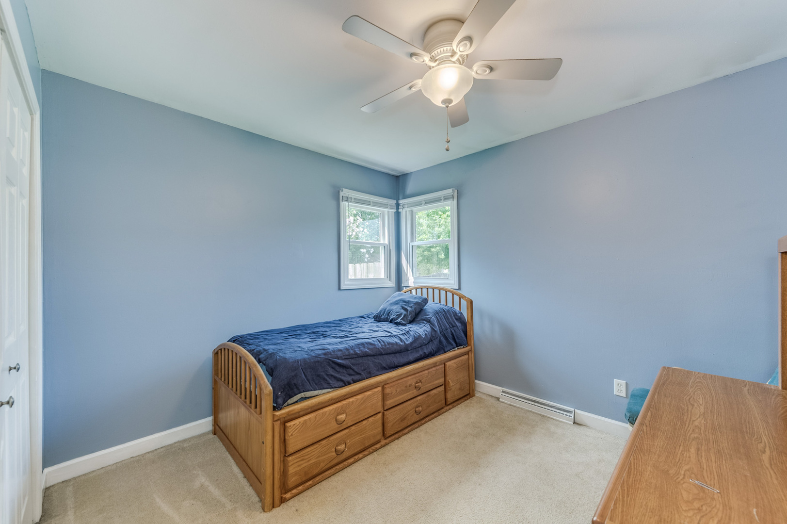 713 South Cooper Road New Lenox, IL 60451 - Photo 18 of 21 a living room with a bed furniture chandelier and a window
