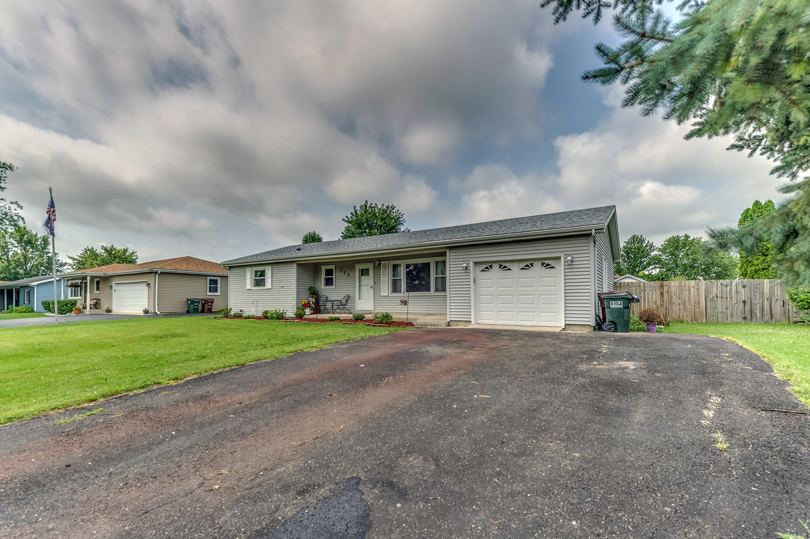 713 South Cooper Road New Lenox, IL 60451 - Photo 3 of 21 a front view of a house with a yard and garage