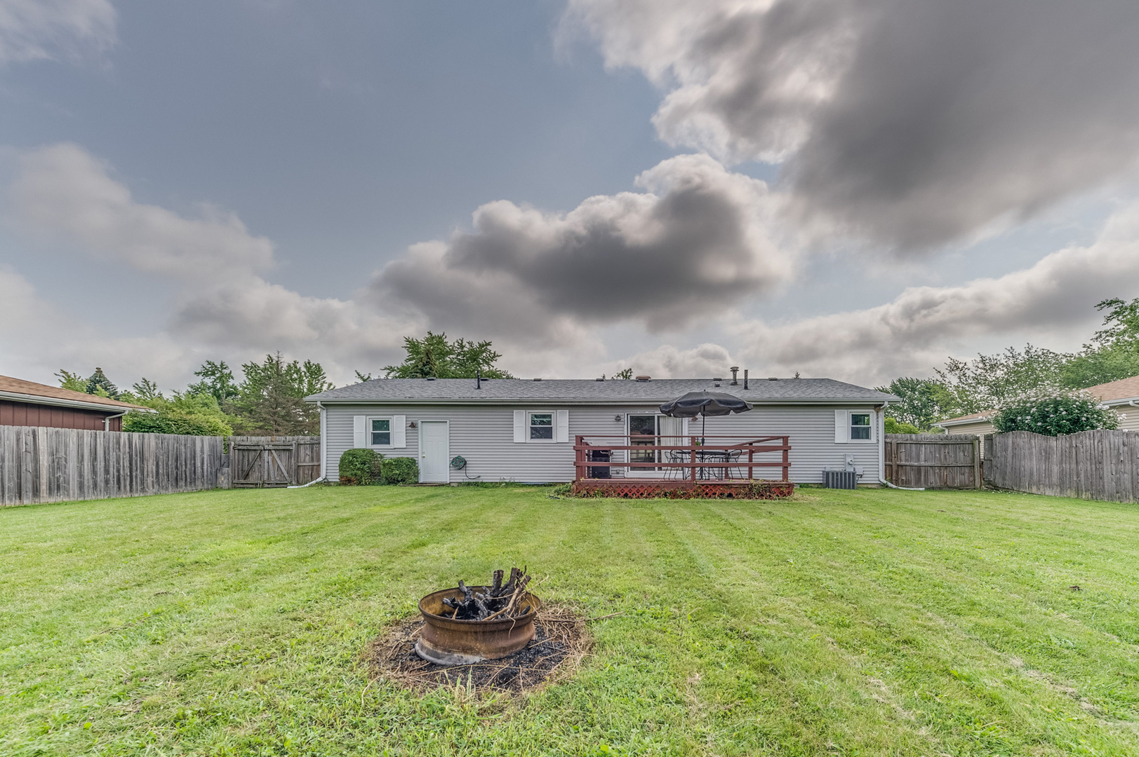 713 South Cooper Road New Lenox, IL 60451 - Photo 21 of 21 a view of a house with a yard and sitting area
