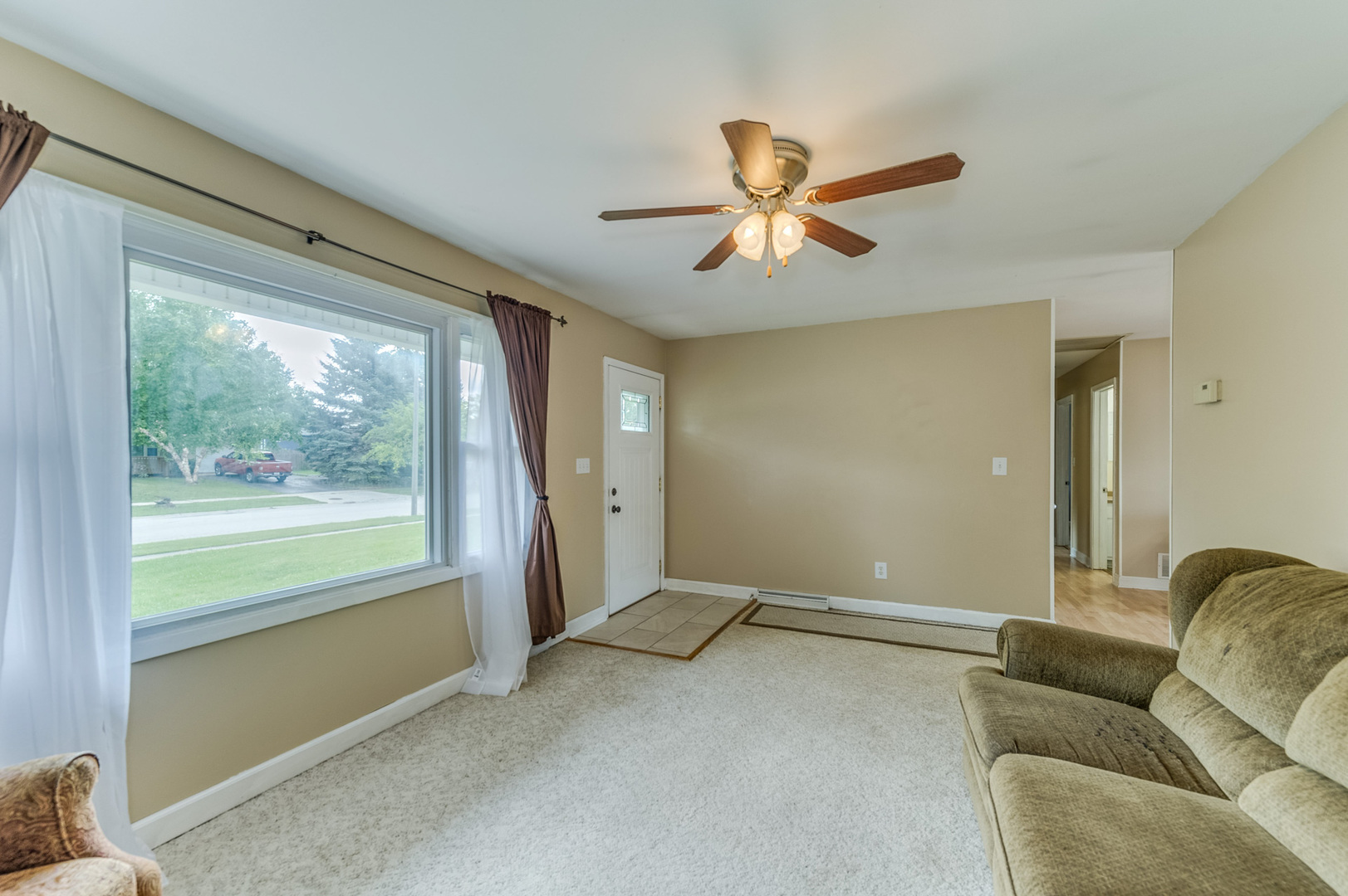 713 South Cooper Road New Lenox, IL 60451 - Photo 5 of 21 a living room with furniture and a large window