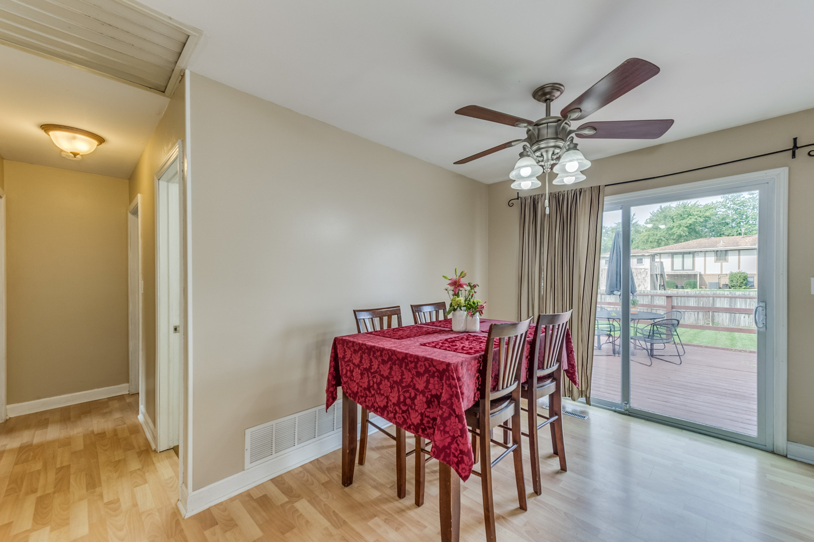 713 South Cooper Road New Lenox, IL 60451 - Photo 6 of 21 a view of a dining room with furniture window and wooden floor