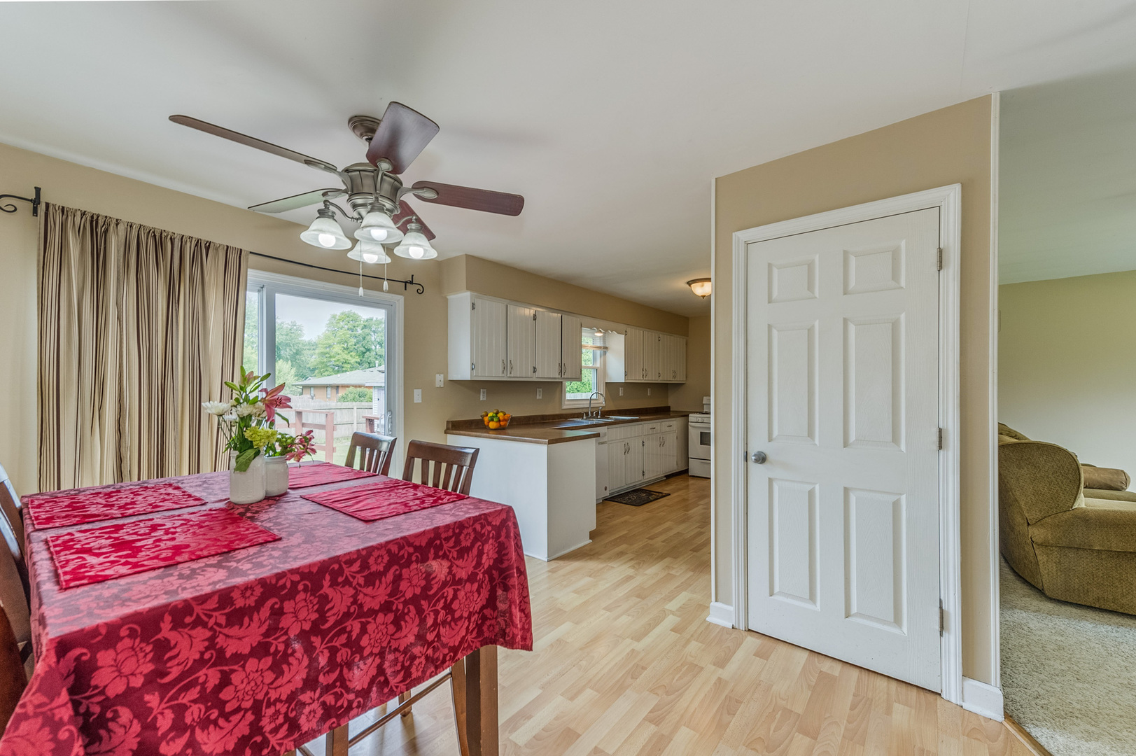 713 South Cooper Road New Lenox, IL 60451 - Photo 7 of 21 a bed room with a bed and a chandelier