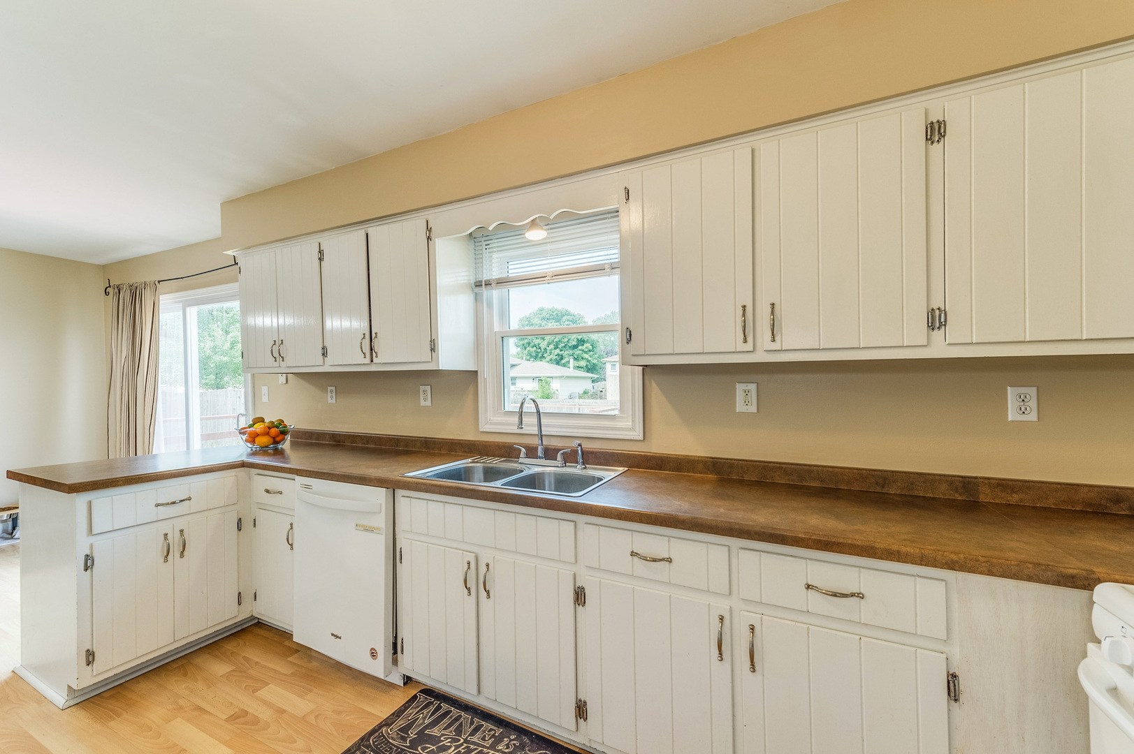 713 South Cooper Road New Lenox, IL 60451 - Photo 10 of 21 a kitchen with granite countertop white cabinets white appliances and a sink