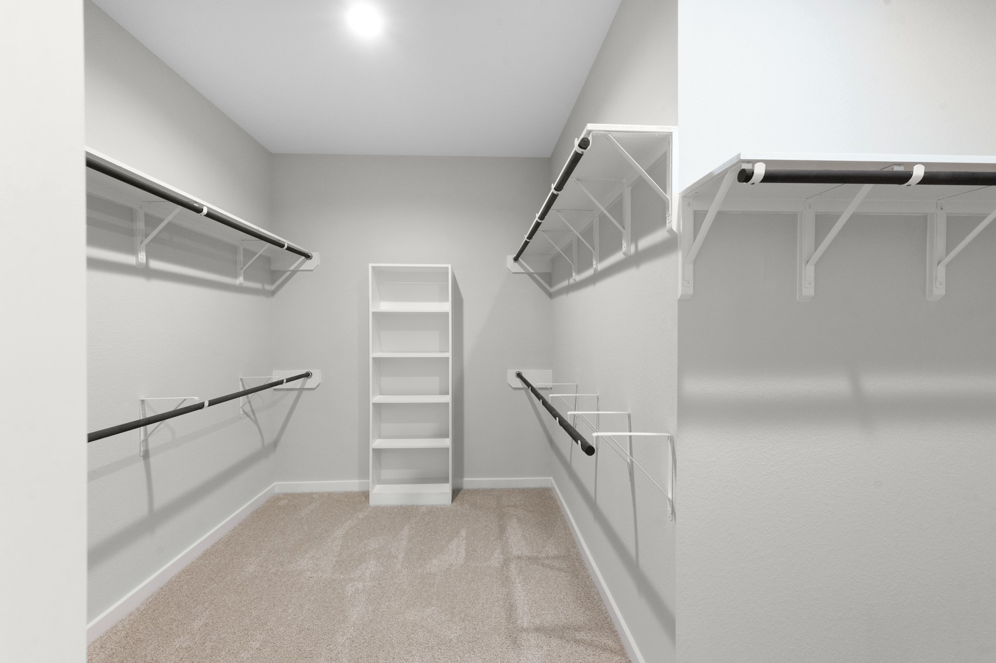 3107 Spitfire Drive Rosenberg, TX 77471 - Photo 14 of 39 a view of walk in closet with empty racks