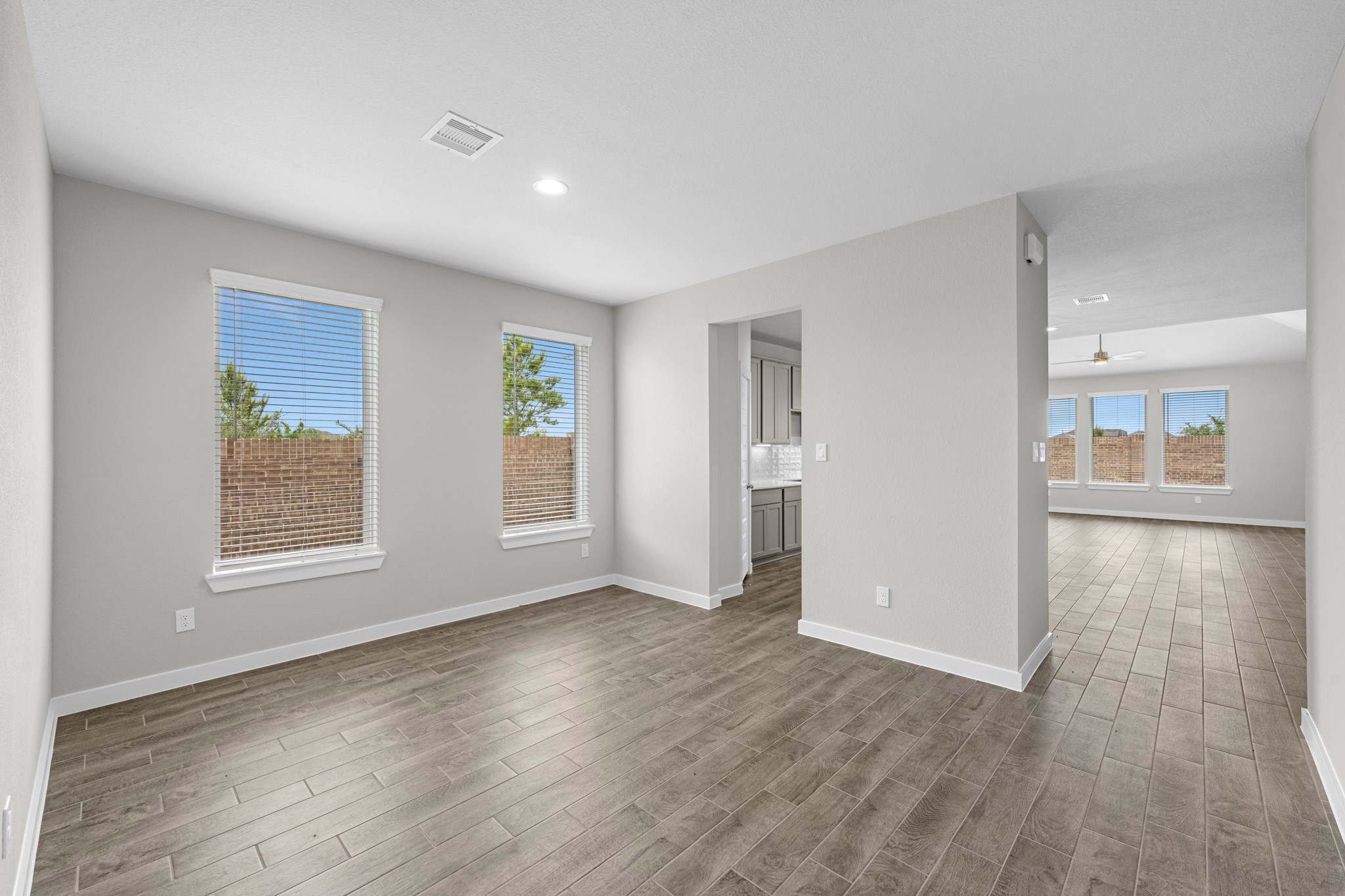 3107 Spitfire Drive Rosenberg, TX 77471 - Photo 15 of 39 wooden floor in an empty room with a window