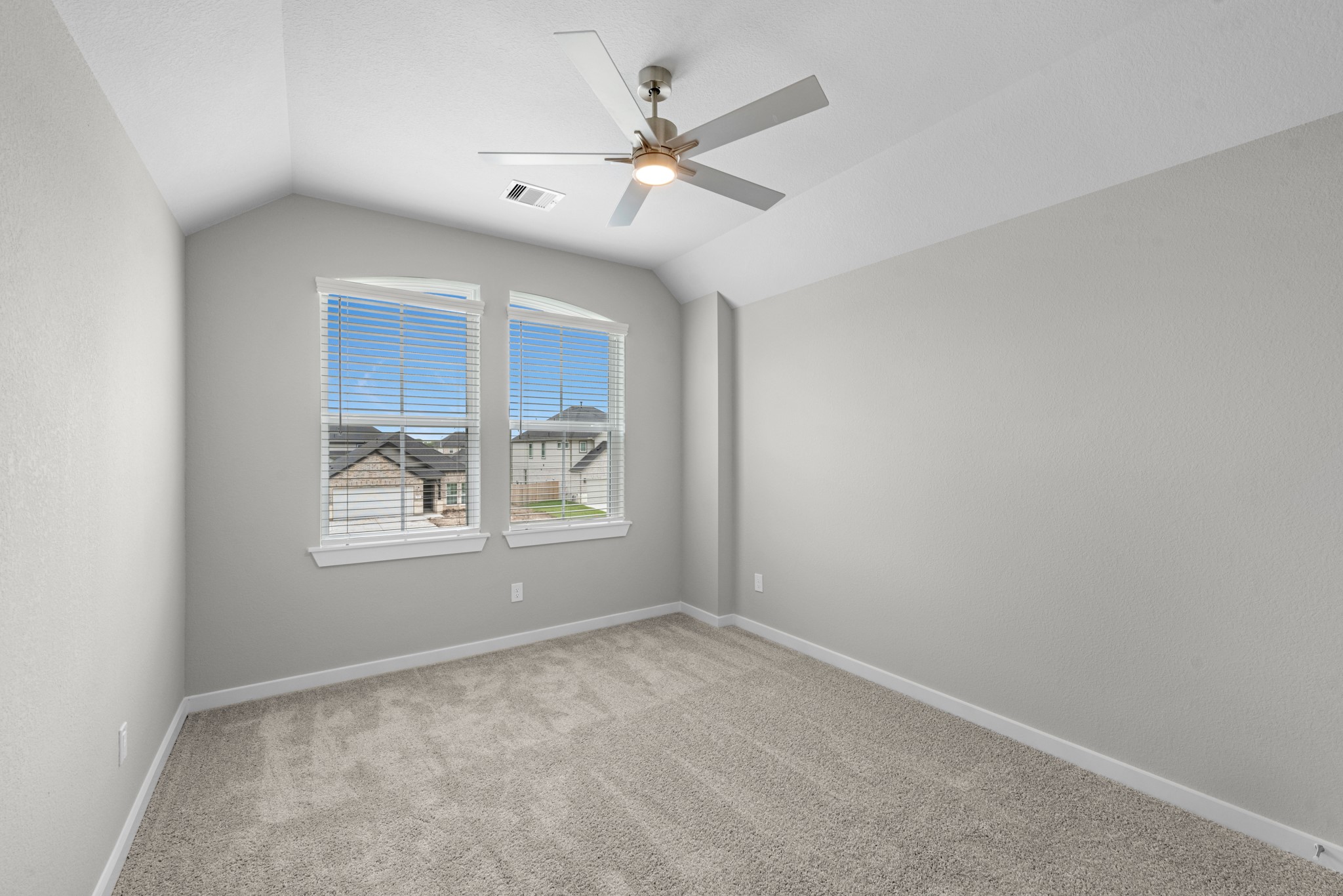 3107 Spitfire Drive Rosenberg, TX 77471 - Photo 22 of 39 an empty room with windows and fan