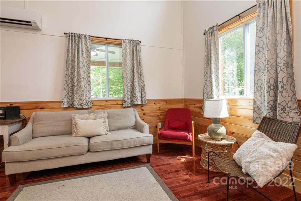 29 Davidson Road Asheville, NC 28803 - Photo 11 of 37 a living room with furniture and a window