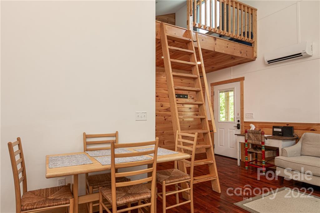 29 Davidson Road Asheville, NC 28803 - Photo 12 of 37 a view of a dinning room with wooden floor and seating space