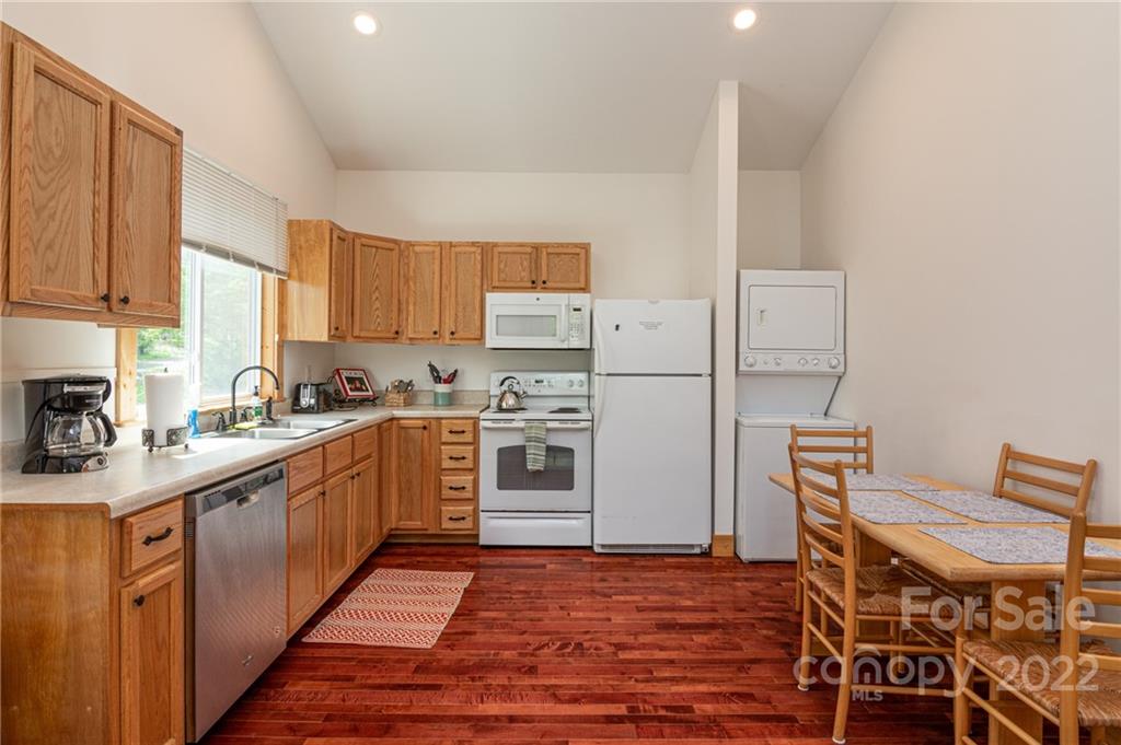 29 Davidson Road Asheville, NC 28803 - Photo 13 of 37 a kitchen with cabinets and wooden floor