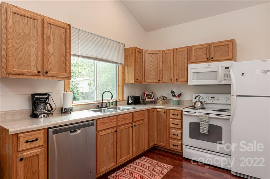 29 Davidson Road Asheville, NC 28803 - Photo 14 of 37 a kitchen with a sink stove and cabinets
