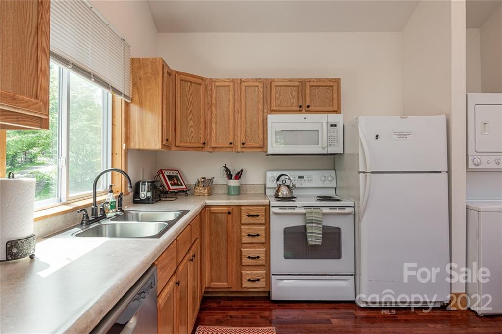 29 Davidson Road Asheville, NC 28803 - Photo 15 of 37 a kitchen with stainless steel appliances granite countertop a sink stove and refrigerator