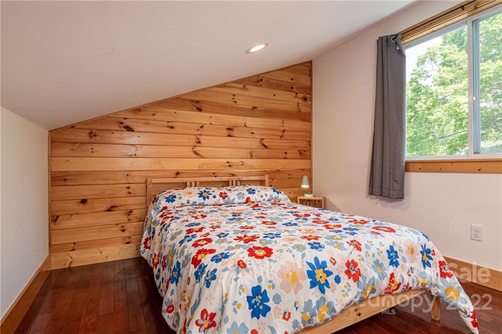 29 Davidson Road Asheville, NC 28803 - Photo 18 of 37 a bedroom with a bed and a window
