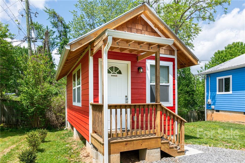 29 Davidson Road Asheville, NC 28803 - Photo 26 of 37 a front view of house with yard and trees in the background