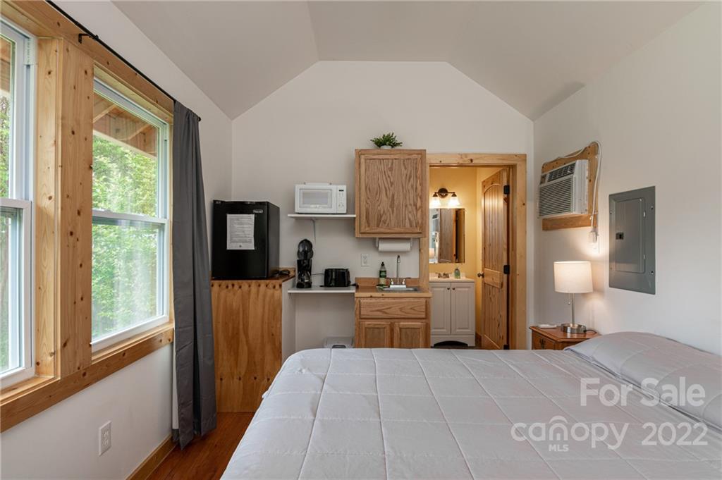 29 Davidson Road Asheville, NC 28803 - Photo 30 of 37 a kitchen with a refrigerator and a stove top oven