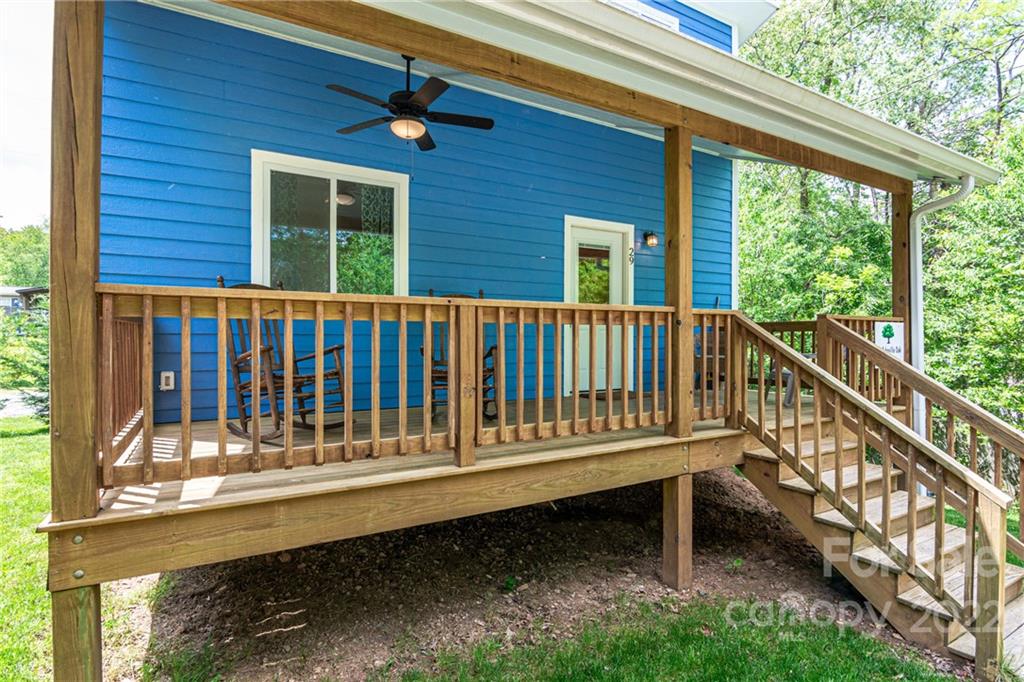 29 Davidson Road Asheville, NC 28803 - Photo 3 of 37 a view of a wooden deck with a bench