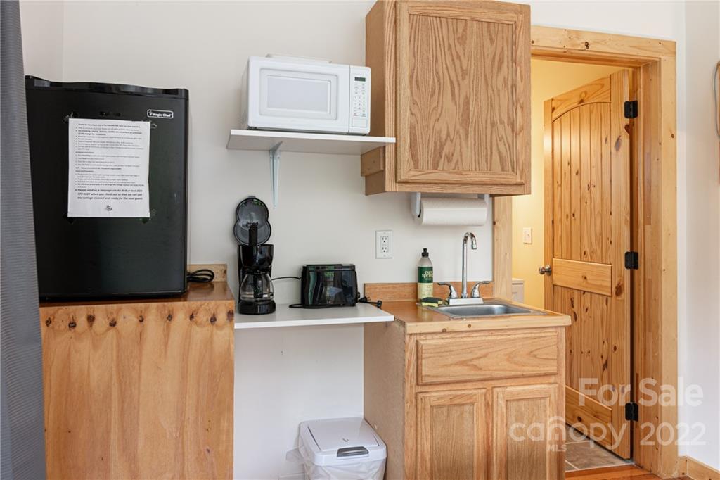 29 Davidson Road Asheville, NC 28803 - Photo 34 of 37 a kitchen with stainless steel appliances a sink a stove a refrigerator a counter top space and cabinets