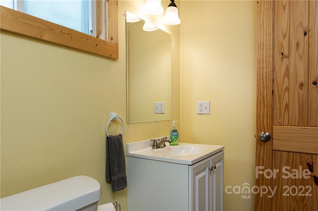 29 Davidson Road Asheville, NC 28803 - Photo 36 of 37 a bathroom with a sink and a toilet