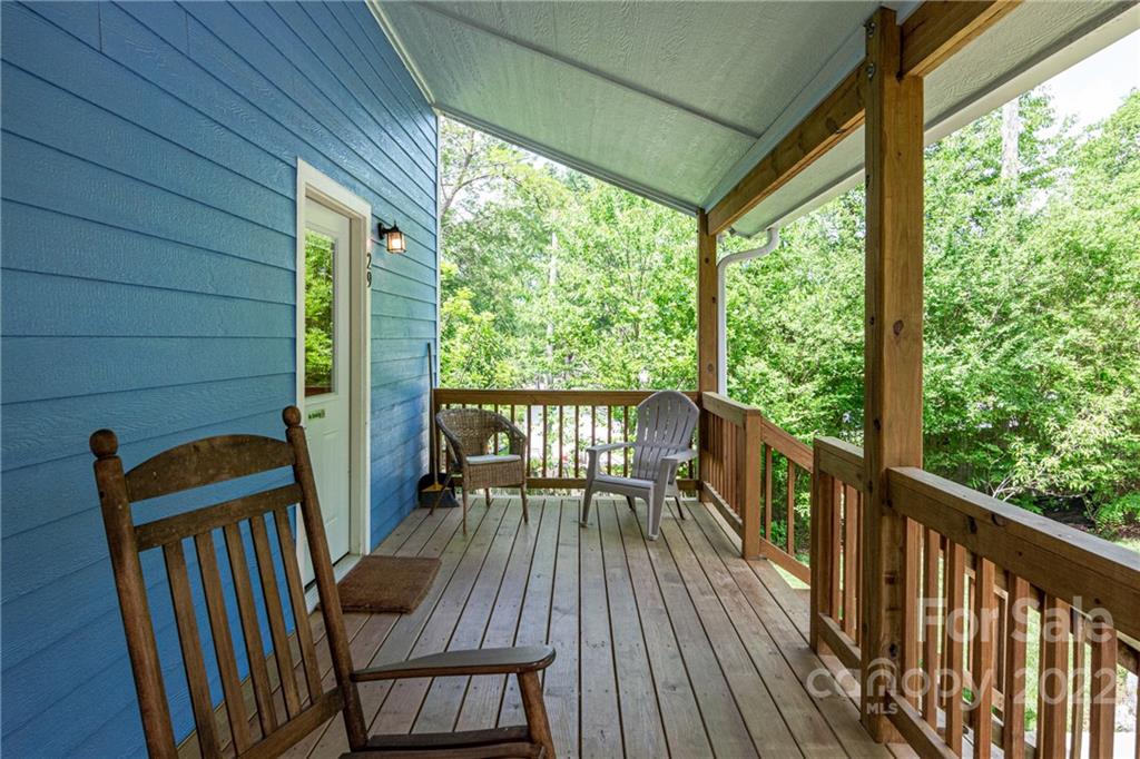 29 Davidson Road Asheville, NC 28803 - Photo 5 of 37 a view of balcony with wooden floor and outdoor seating