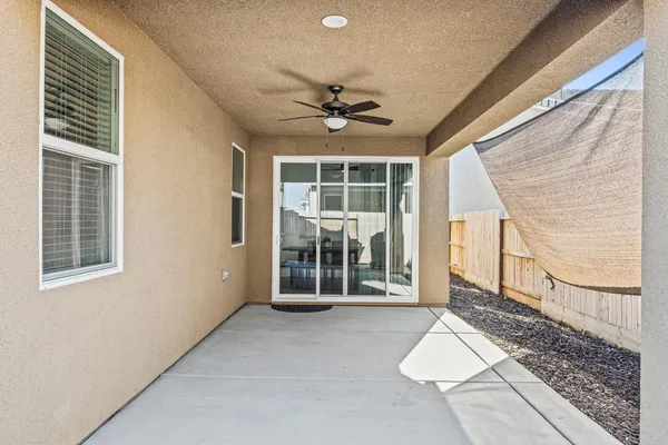 a view of a house with backyard and deck