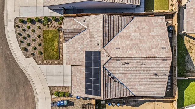 an aerial view of a house with a swimming pool