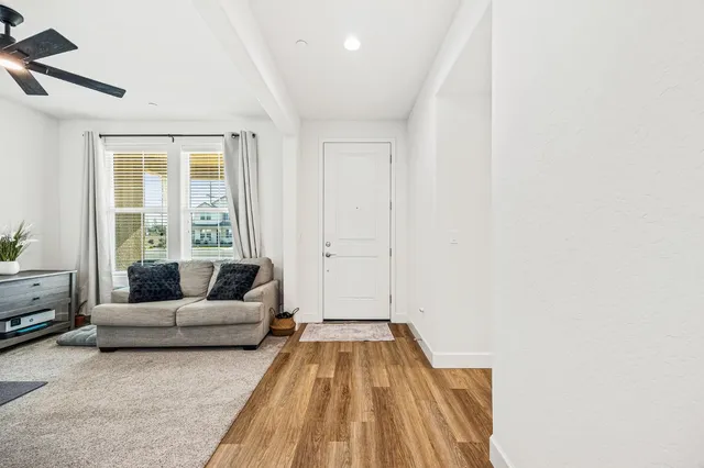 a living room with furniture and a large window
