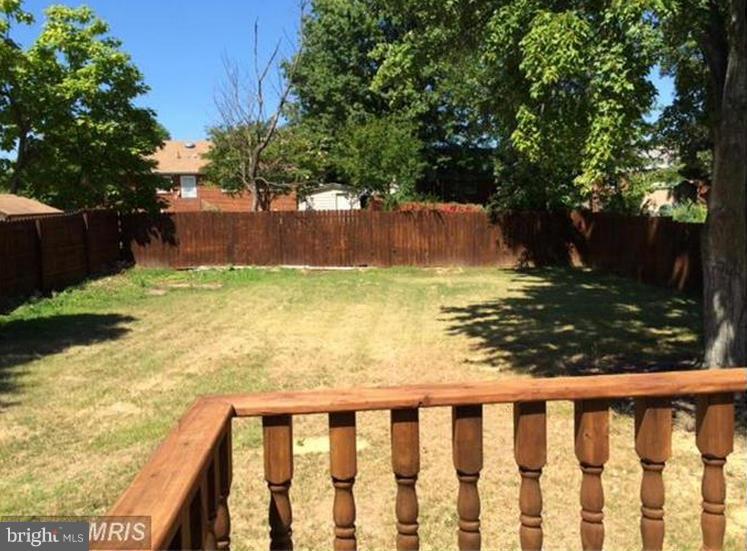 6022 Brunswick Street Springfield, VA 22150 - Photo 2 of 24 a view of a yard with wooden fence