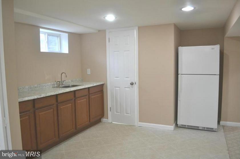 6022 Brunswick Street Springfield, VA 22150 - Photo 11 of 24 a bathroom with a double vanity sink and a