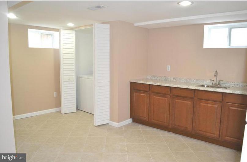 6022 Brunswick Street Springfield, VA 22150 - Photo 12 of 24 a view of kitchen with granite countertop cabinets and sink