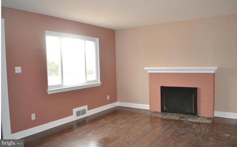 6022 Brunswick Street Springfield, VA 22150 - Photo 20 of 24 a room with a fireplace and a window